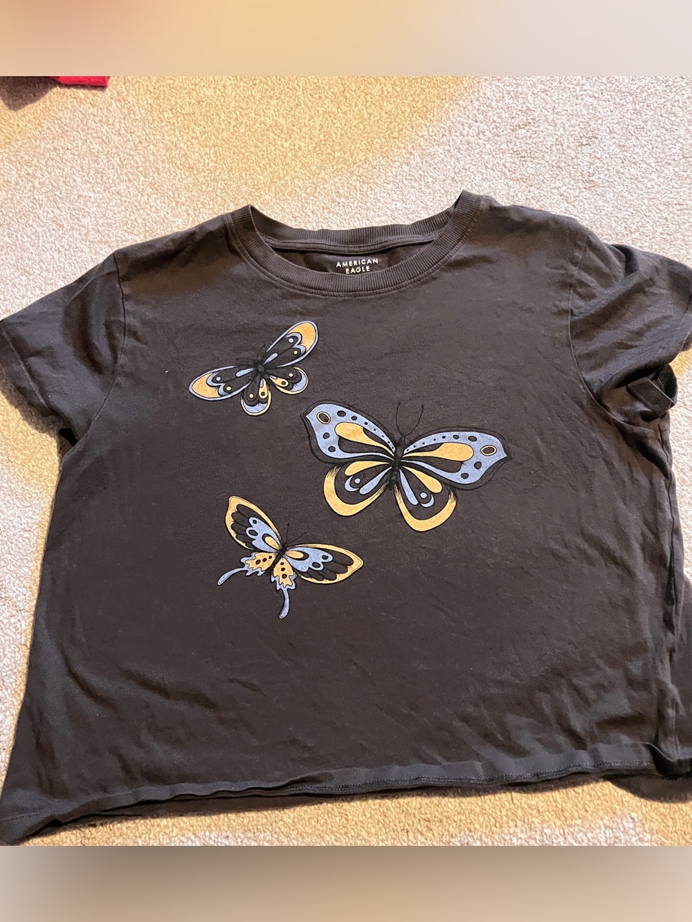 American Eagle Outfitters Black Tee with Yellow & Light Blue Butterfly Print